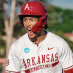 Arkansas outfielder Damian Ruiz celebrates a hit against Missouri State at regionals.