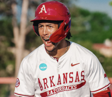 Arkansas outfielder Damian Ruiz celebrates a hit against Missouri State at regionals.