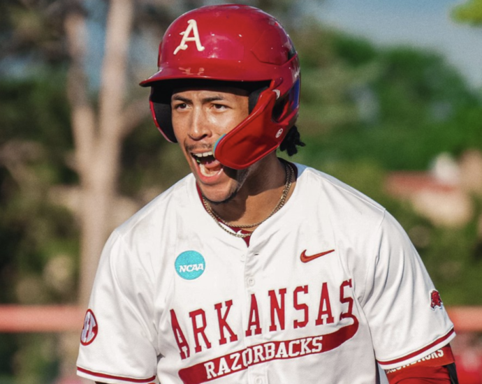 Arkansas outfielder Damian Ruiz celebrates a hit against Missouri State at regionals.