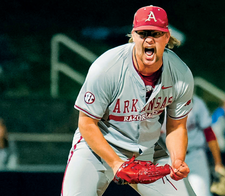 Arkansas Reliever Lands Hogs in National Spotlight Arkansas pitcher Ethan McElvain screams after throwing a strikeout against Kentucky.