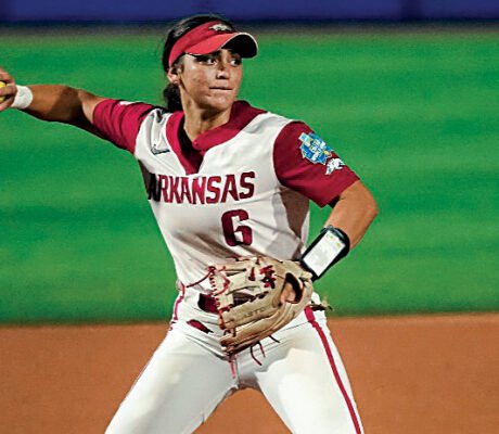Arkansas third baseman Ella McDowell throws out a Nebraska Cornhusker in the opening round of the Women's College World Series.