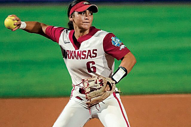 Arkansas third baseman Ella McDowell throws out a Nebraska Cornhusker in the opening round of the Women's College World Series.