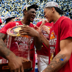 Hogs Gifted Marquee Game for SEC-ACC Challenge Arkansas celebrates winning the SEC Tournament.